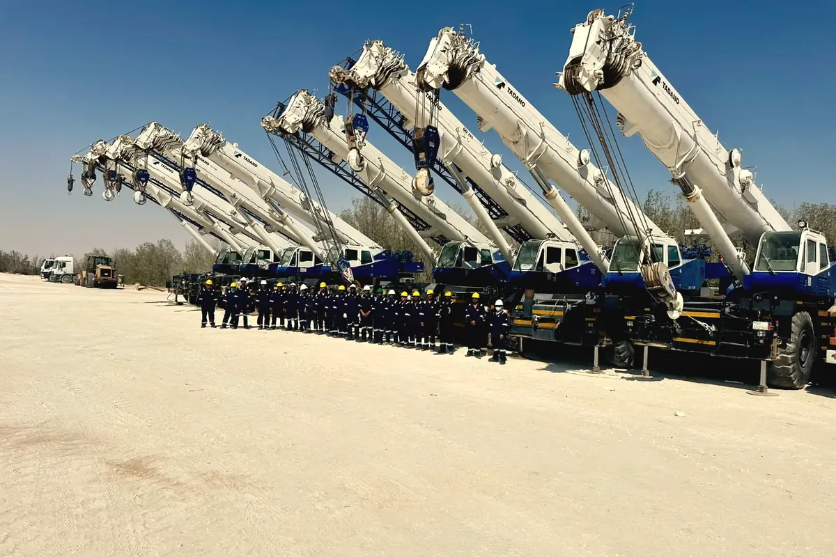 Ajyal's rough-terrain crane line with booms raised and crews beneath