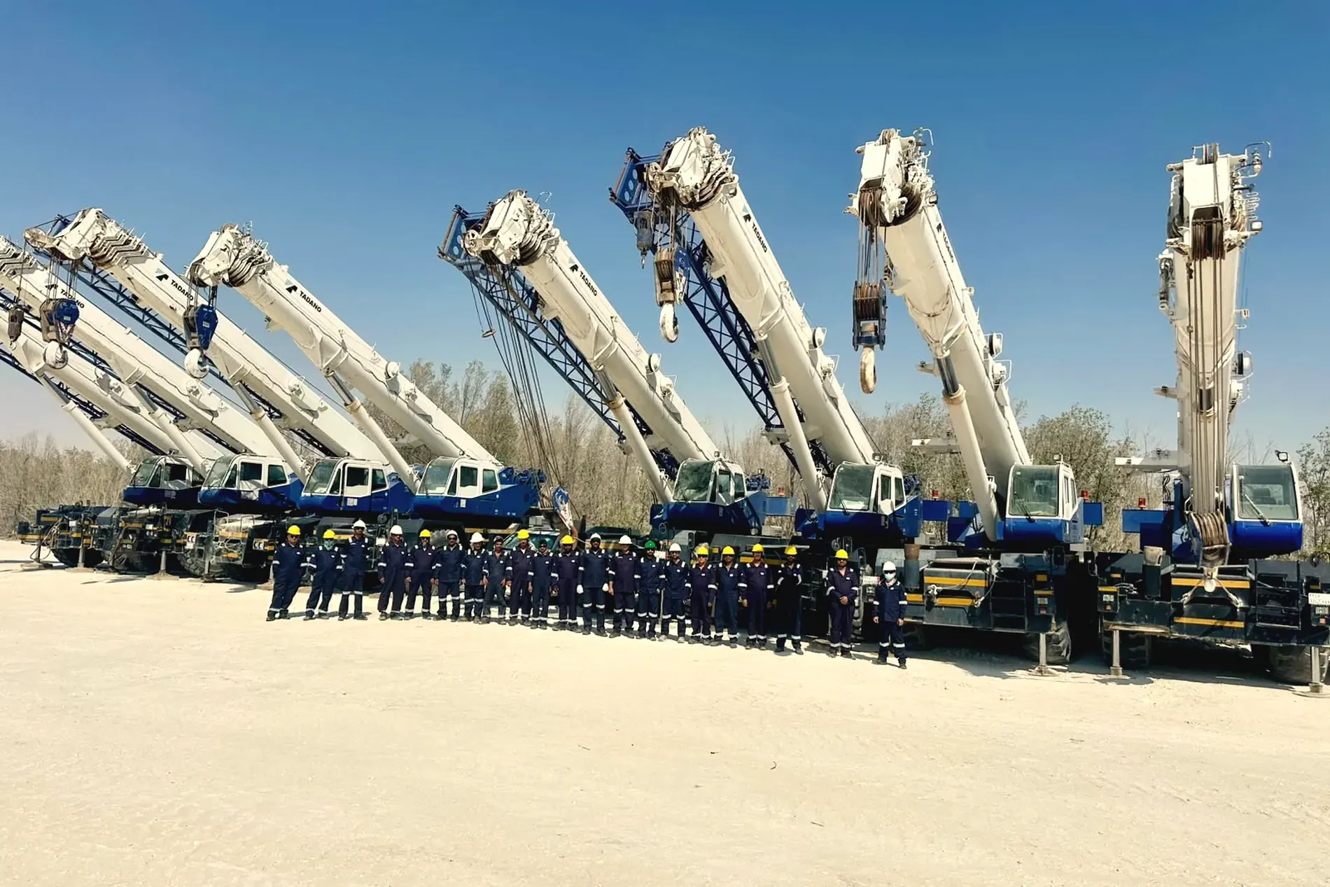 Ajyal's hydraulic mobile crane line with booms raised, Al Khobar yard