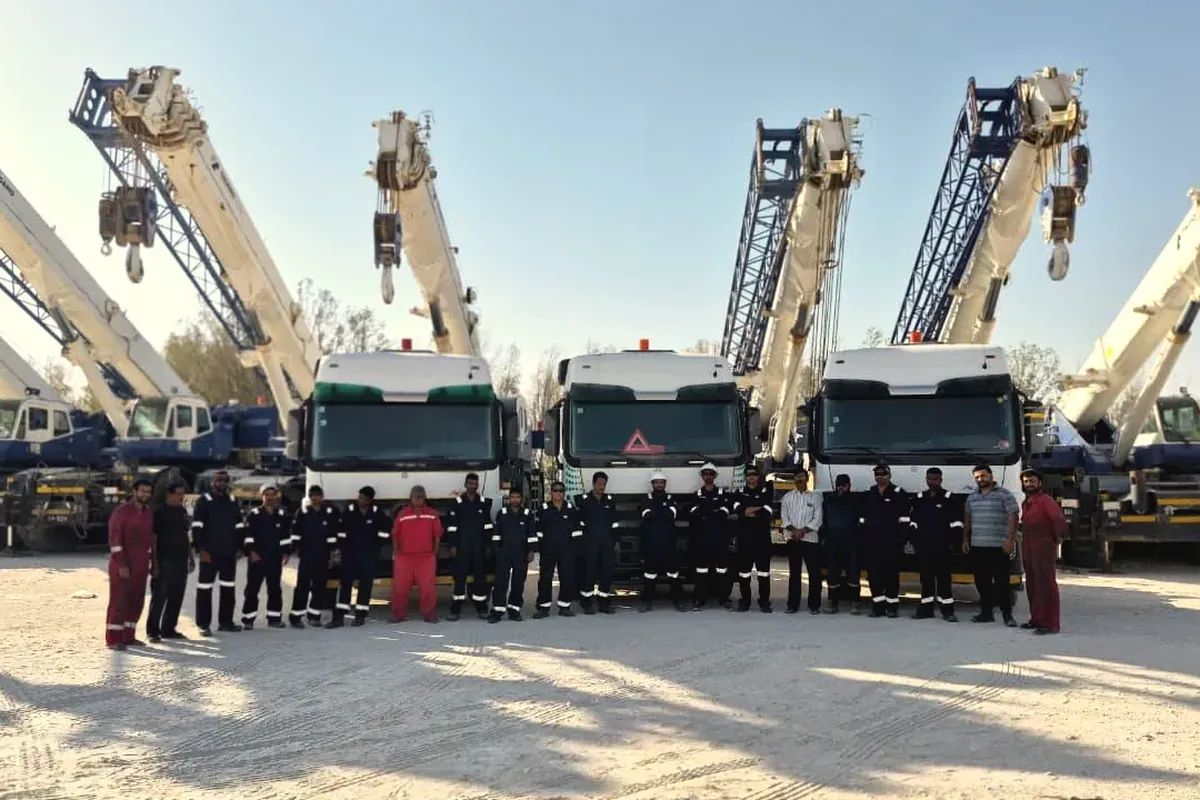 Ajyal's cranes, trucks and crew lined up together in the Al Khobar yard