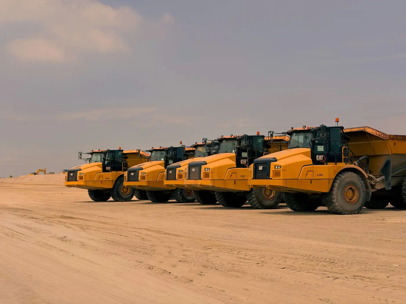 Line-up of heavy plant in the desert