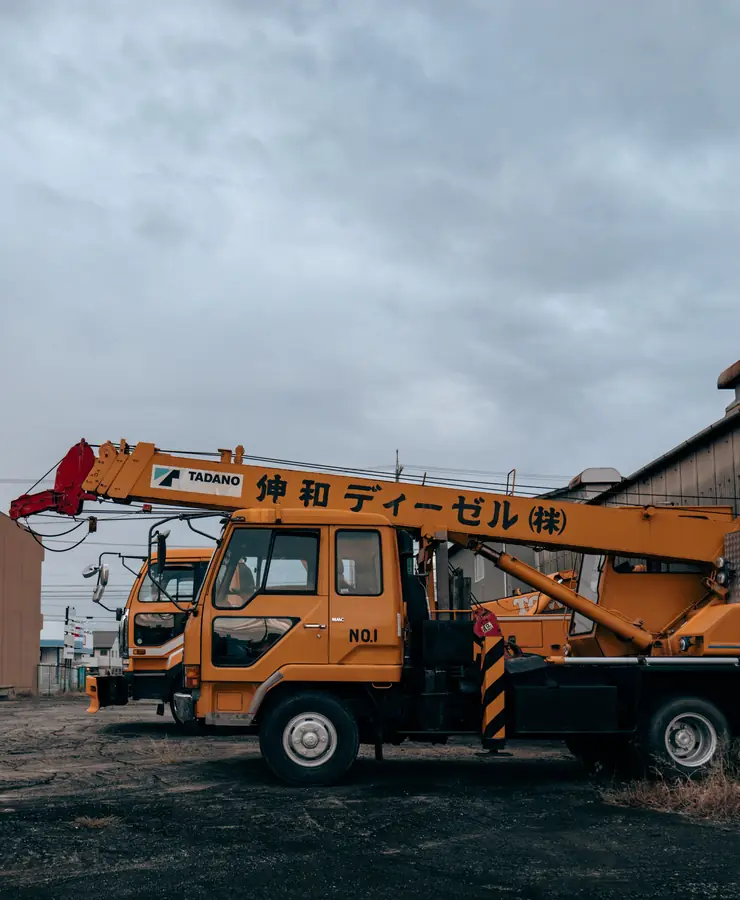 Tadano truck-mounted telescopic crane parked under a grey sky