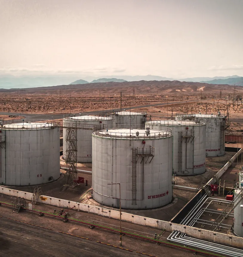 Oil storage tanks in a desert landscape from the air
