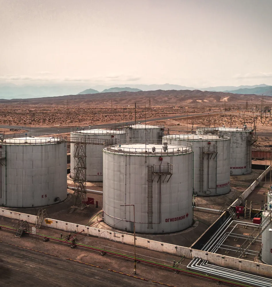 Oil storage tanks in a desert landscape from the air