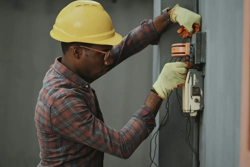 Technician wiring a control panel